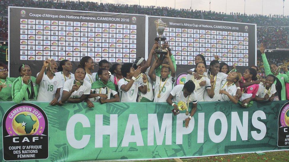 Nigeria soccer players and team officials celebrate