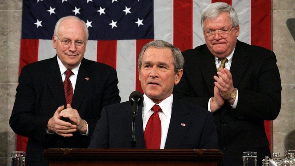 George W Bush, centre, with Dick Cheney, left, and Dennis Hastert