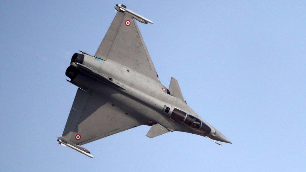 A French Rafale fighter jet performs during the Dubai Airshow on November 12, 201