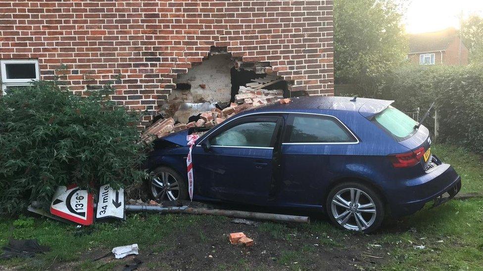 Car driven into house