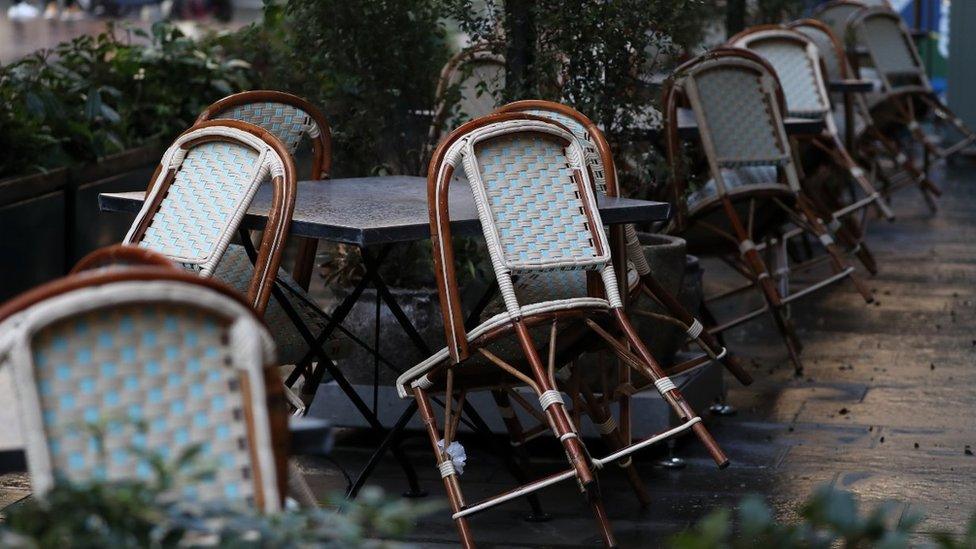 Chairs sit against tables at The Ivy restaurant in Glasgow, Scotland where severe lockdown restrictions are in place