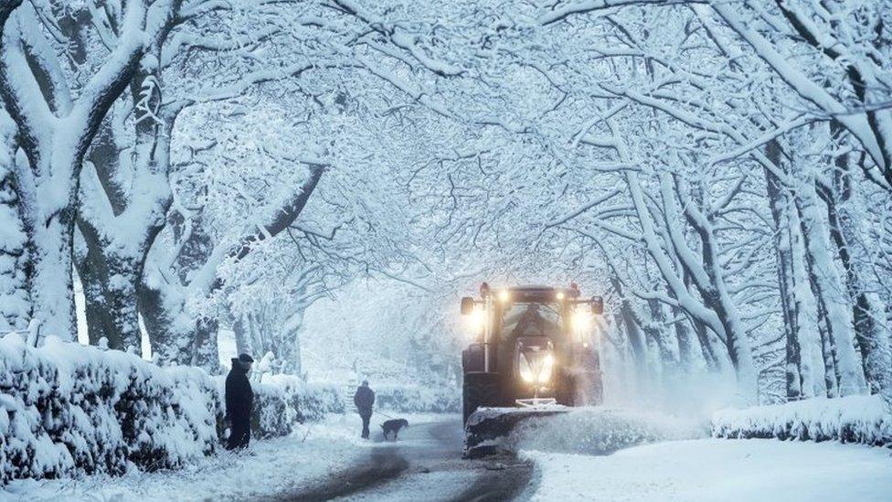 A snowplough clears heavy overnight snow in Carrshield in the Pennines, near Hexham in Northumberland