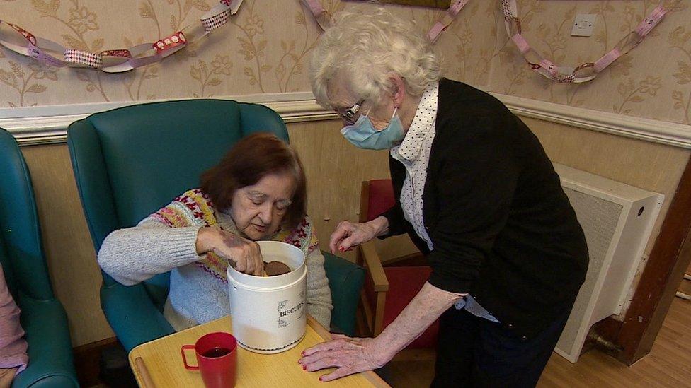 Nursing home carer and resident