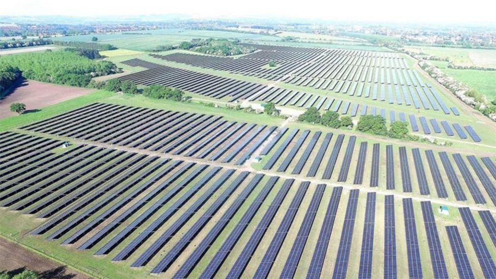 Artist impression of the solar farm to be built near Howden. It shows rows of panels in fields surrounded by trees. 