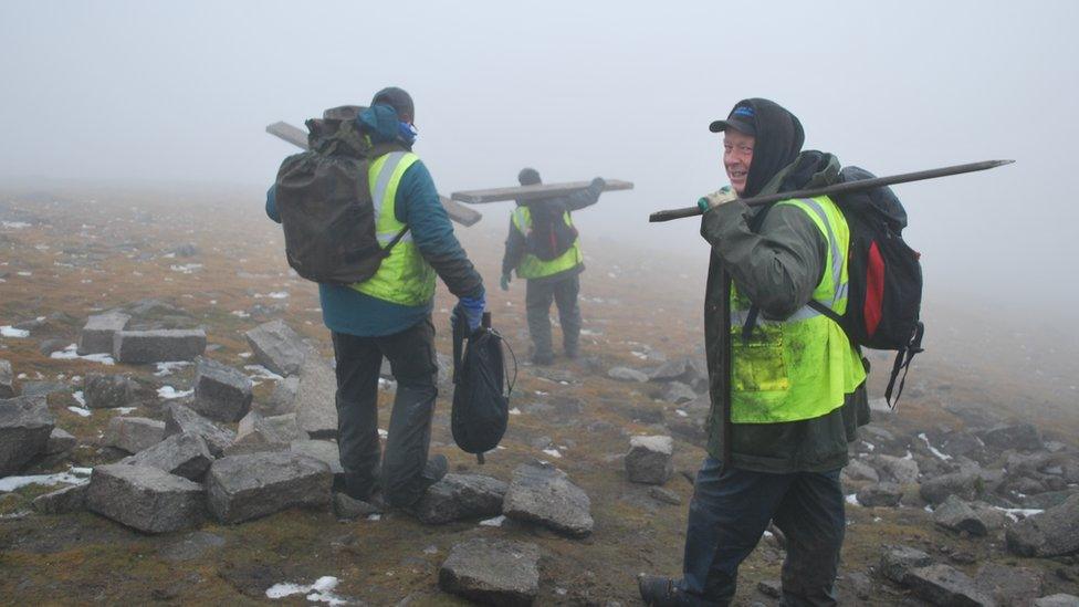 The stonemasons making their way back down Slieve Donard