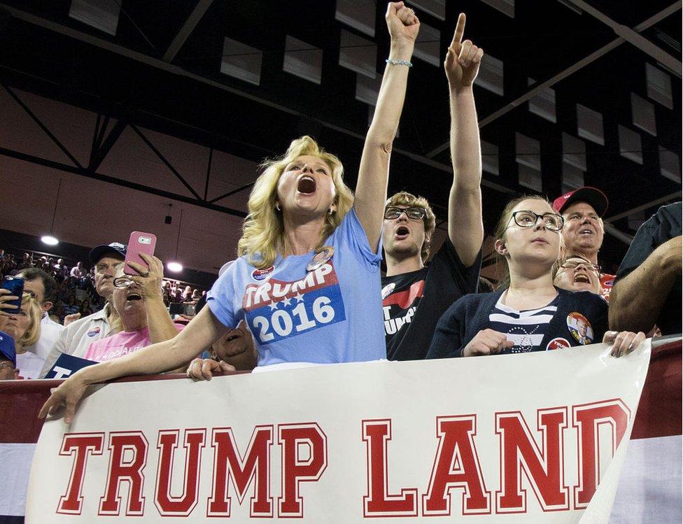 Maree Miller, of Cairo, Ga., reacts to Republican presidential candidate Donald Trump as he speaks to supporters during a rally at Valdosta State University