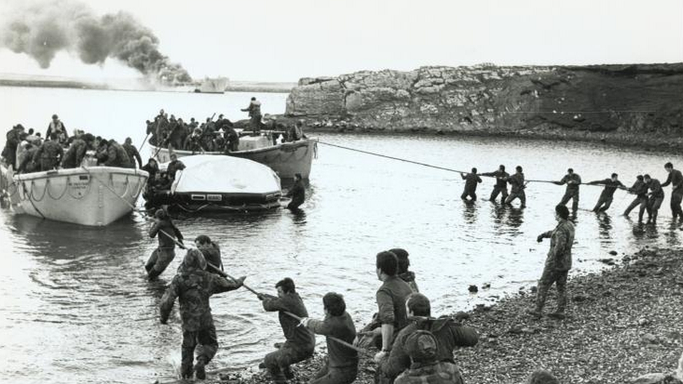 Survivors coming ashore from the bombed Sir Galahad