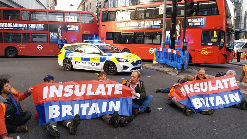 Insulate Britain protesters blocking a road in Liverpool Street, central London.