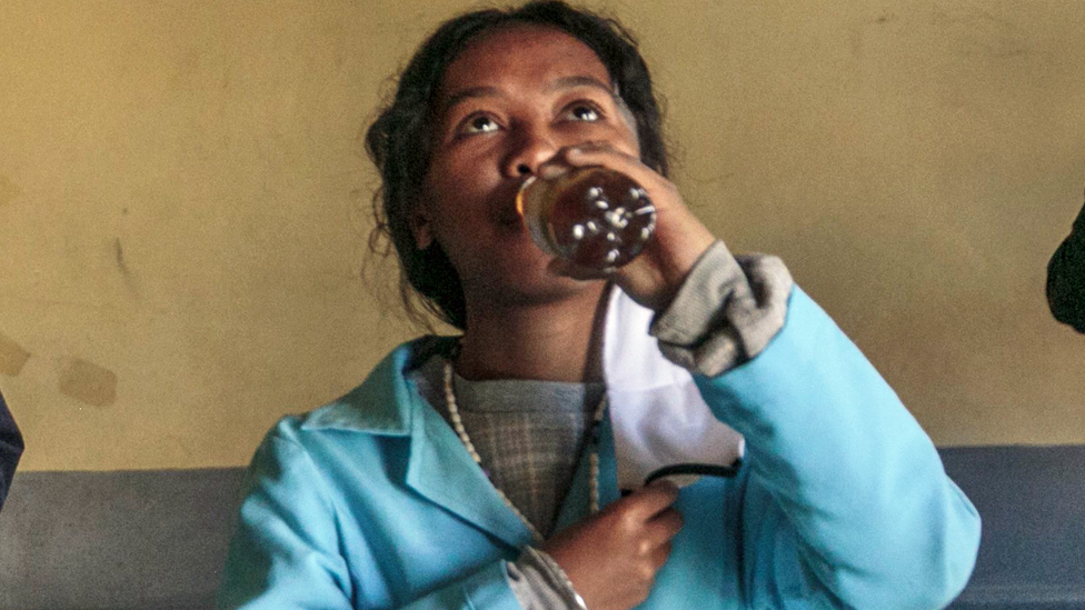 Students in Madagascar drinking the Covid-Organics herbal tonic - April 2020