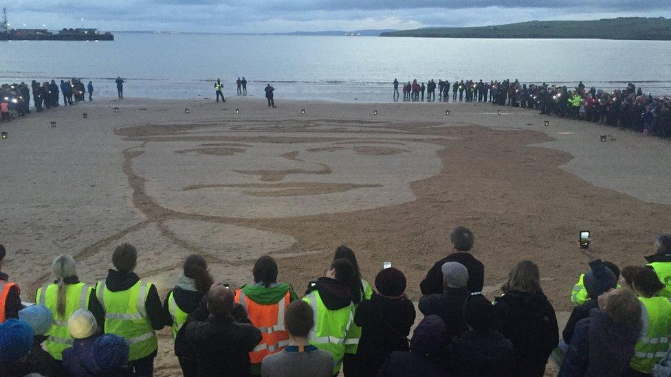 Portrait of Lieutenant Robert William Taylor in the sand at Scapa beach