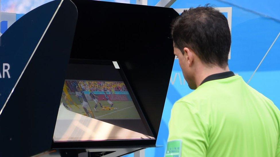 referee-reviewing-VAR.