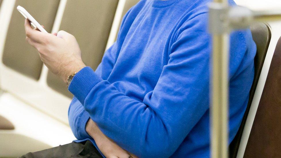 Phone user on public transport