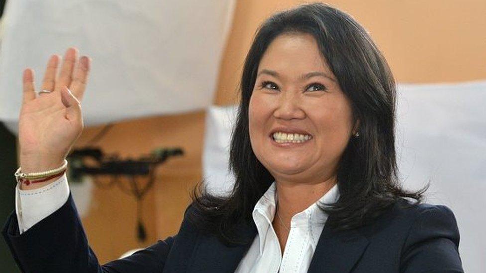 Peru's presidential candidate Keiko Fujimori for Fuerza Popular (Popular Strength) party, shows her identity document after voting in the runoff round in Lima on June 5, 2016.