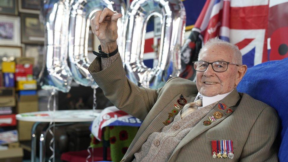 Normandy veteran Tommy Trotter celebrates his 100th birthday at The Last Post in Thornaby with balloons behind him spelling out 100