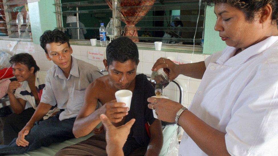 A nurse in distributes ethanol to methanol poisoning victims in Nicaragua (2006)