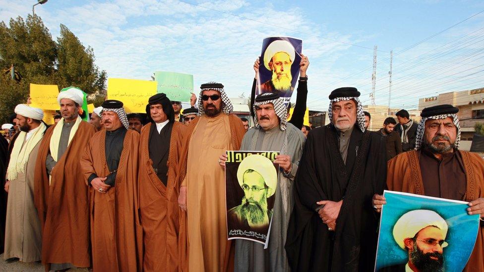 Iraqis hold placards bearing portraits of prominent Shia Muslim cleric Nimr al-Nimr during a protest held in the capital Baghdad, on January 3, 2016, against his execution by Saudi authorities. The Saudi cleric was a driving force of the protests that broke out in 2011 in Saudi Arabia's east, an oil-rich region where the Shia minority of an estimated two million people complains of marginalisation.