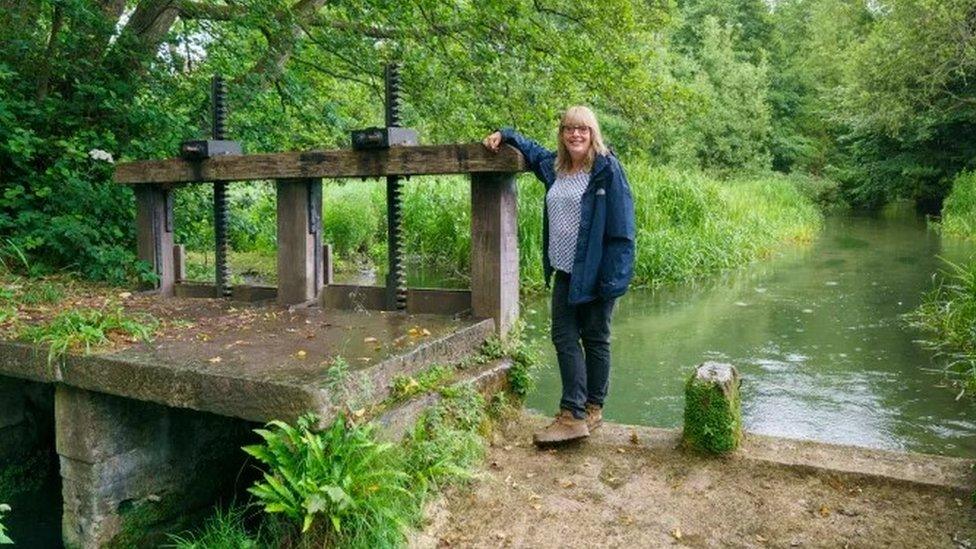 Clare Mahdiyone standing by the millpond