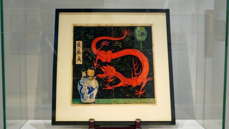 Painting for the original cover of "The Blue Lotus" Tintin comic book on display before the auction