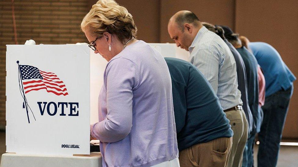 Voters cast their ballots in the US presidential election at a fire station in Alhambra, California.