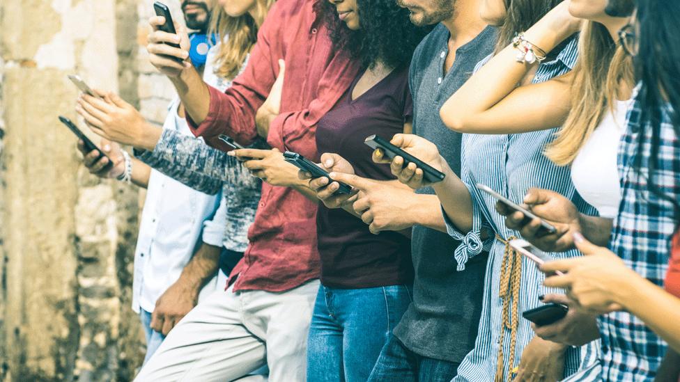 People looking at phones