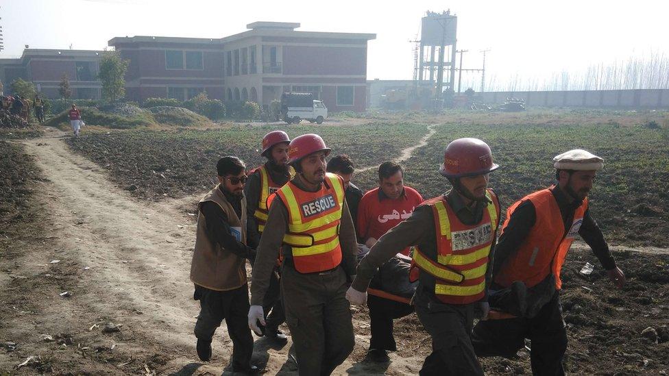 rescuers holding a stretcher