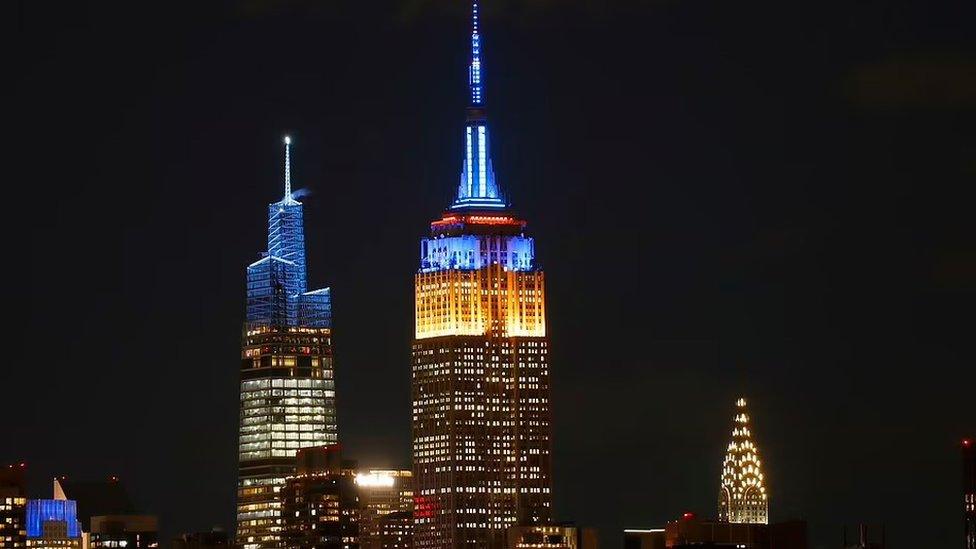 The Empire State Building in New York City was lit up in blue and yellow on Friday night. New York's newest skyscraper One Vanderbilt, pictured behind the Empire State Building, was also illuminated in the same colours.