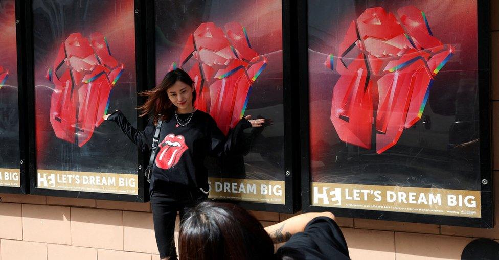 Rolling Stones fan poses for a picture on the day of the launch event of their new album "Hackney Diamonds", outside Hackney Empire in London, Britain, September 6, 2023