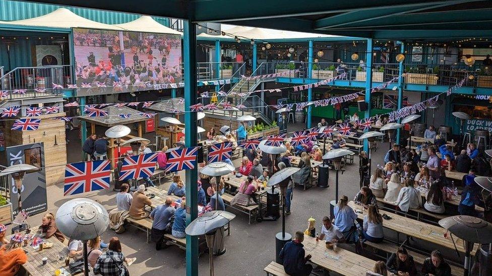 Drinkers at Seaburn's Stack watch the coronation on a large screen