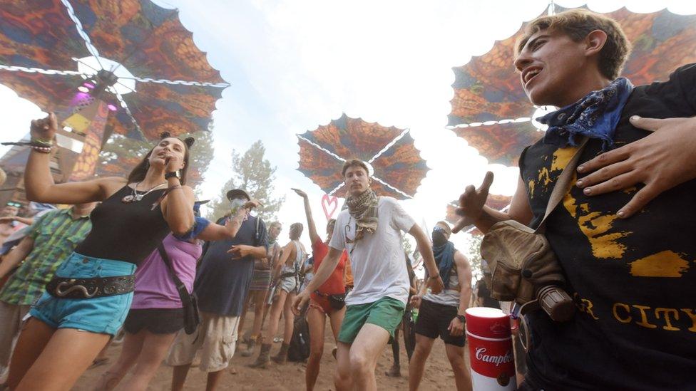 Festival goers dance at the Oregon Eclipse Festival, August 20, 2017, at Big Summit Prairie ranch in Oregon's Ochoco National Forest near the city of Mitchell ahead of the total solar eclipse on August 21, 2017.