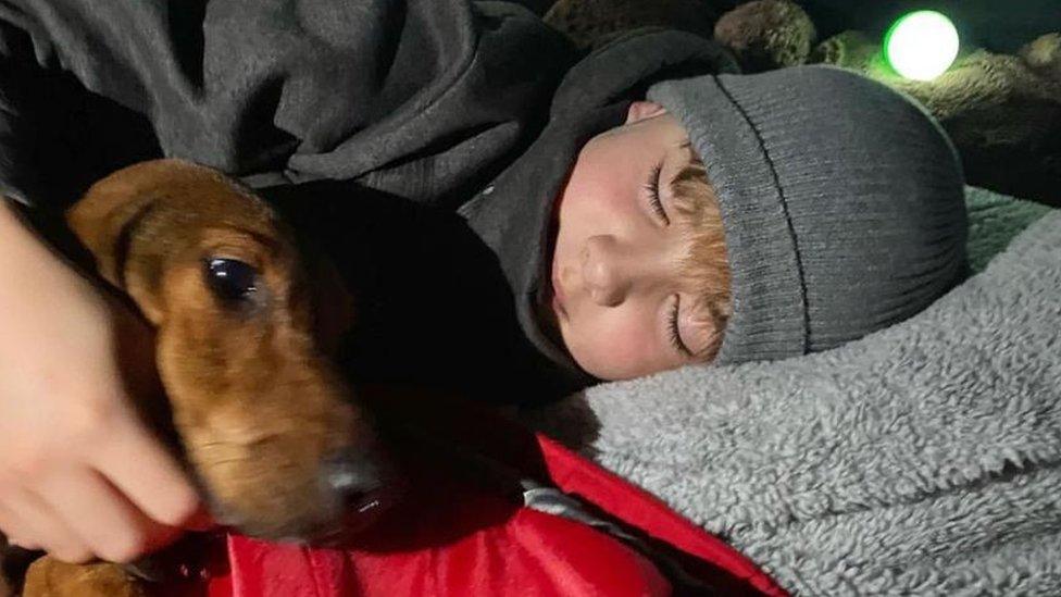 Ashley sleeping his dog Lucia
