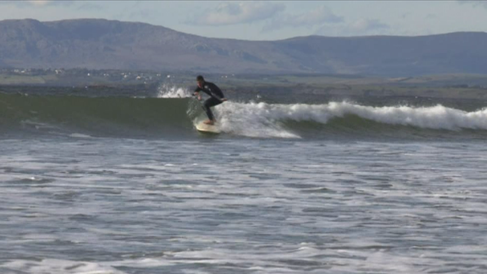 A surfer at Rossnowlagh beach where the sport is more popular than ever