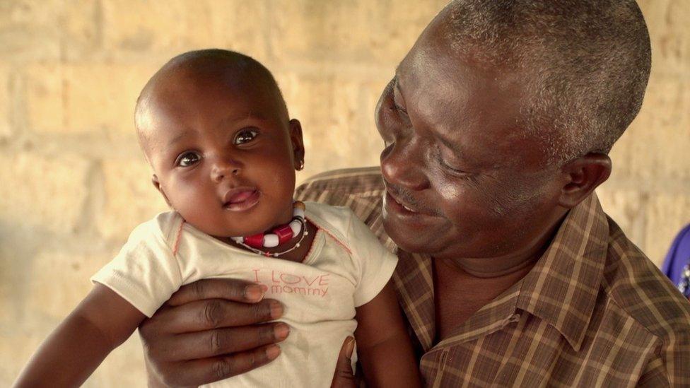 Elhadj Diop and grand-daughter