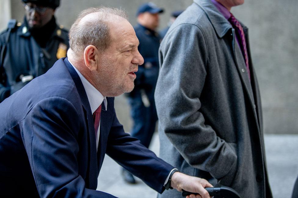 Weinstein arrives in court using a walking frame