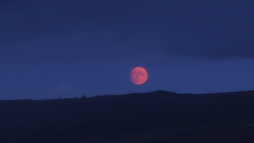 Super blue moon with a pink aura