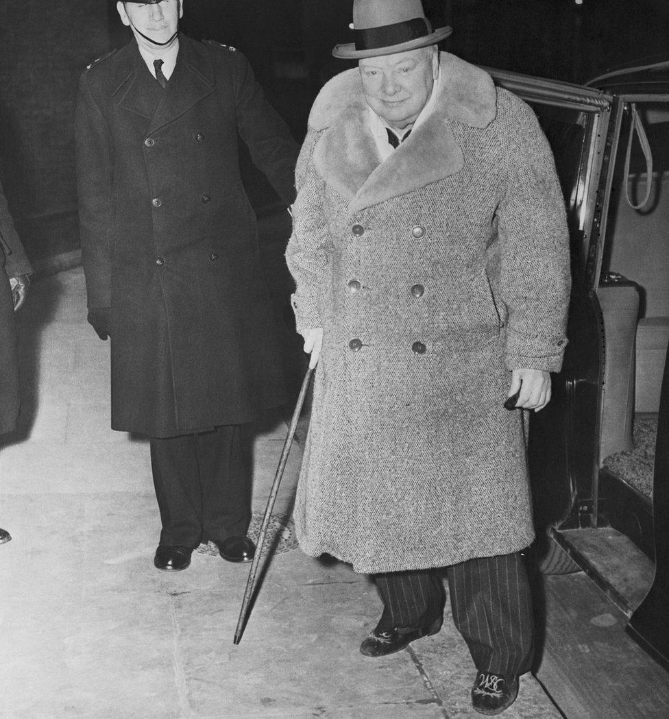 Churchill wearing the slippers