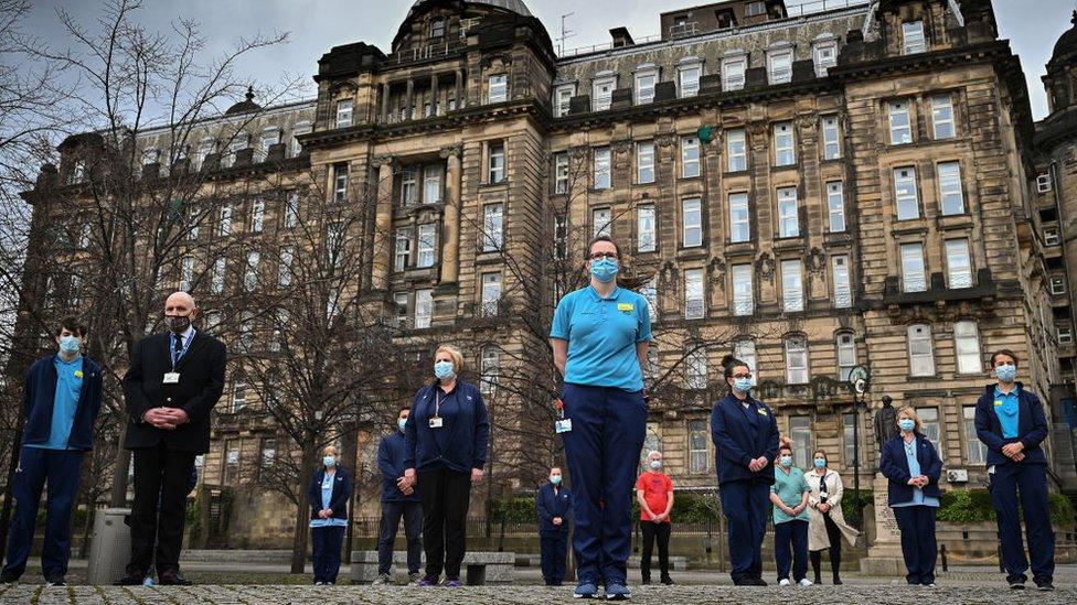 Staff from the Glasgow Royal Infirmary gather outside the hospital for a minute's silence