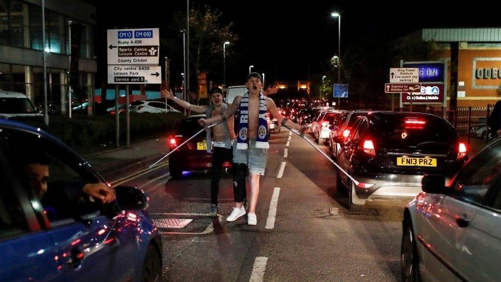 Man in street celebrating