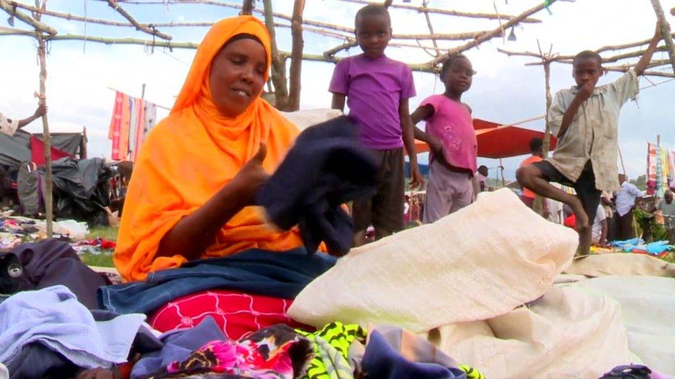 Woman selling clothes in a market