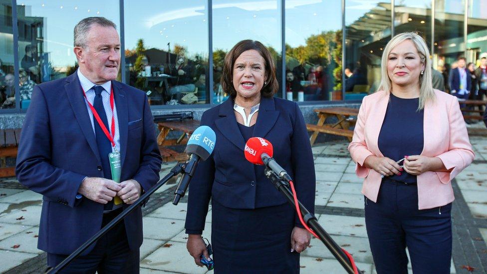 Conor Muprhy pictured alongside Mary Lou McDonald and Michelle O'Neill