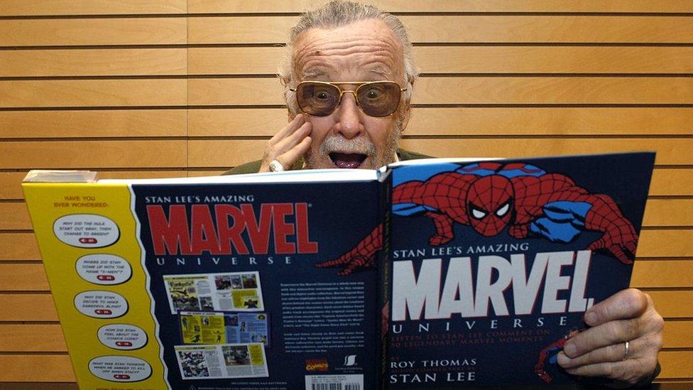 Picture of Stan Lee reading a Marvel book about Spider-Man