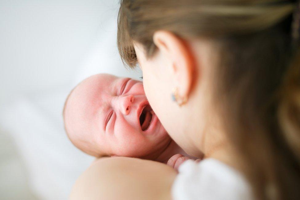 Mother holding baby