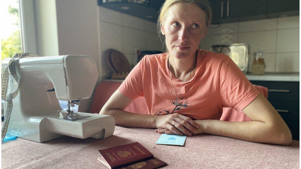 Galina with her sewing machine and Russian passport