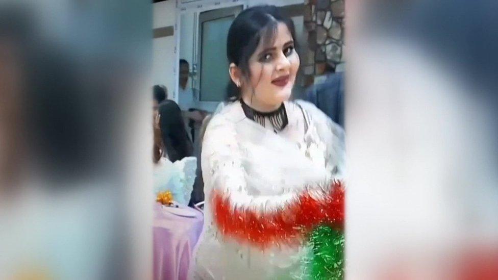 Video showing Mahsa Amini dancing at a wedding, waving a colourful shawl