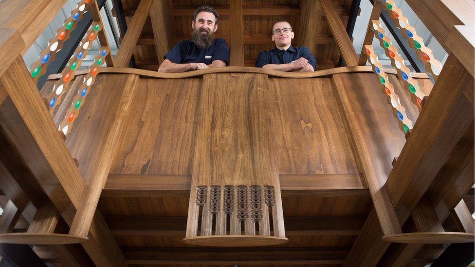 master craftsmen Angus Johnson and Martins Cirulis of Laurence McIntosh in a full-size model of a section of the fire-gutted Mackintosh Library