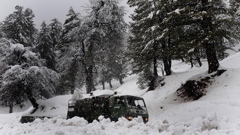 An Indian Army truck travels towards the avalanche site, in Tangmarg on February 8, 2010.