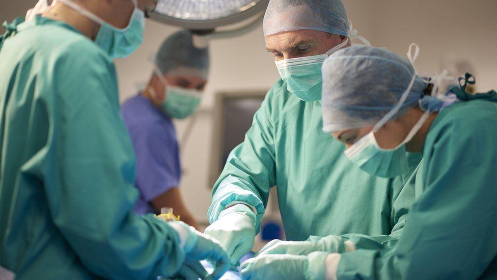 Surgeons in an operating theatre