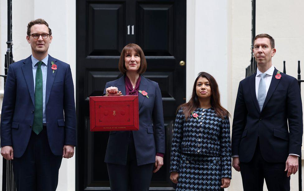 Chief Secretary to the Treasury Darren Jones, Chancellor of the Exchequer Rachel Reeves, Economic Secretary to the Treasury Tulip Siddiq, and Financial Secretary to the Treasury Spencer Livermore, pose for a photo as Reeves holds up her budget box outside number 11 Downing Street in London, Britain, 30 October 2024.