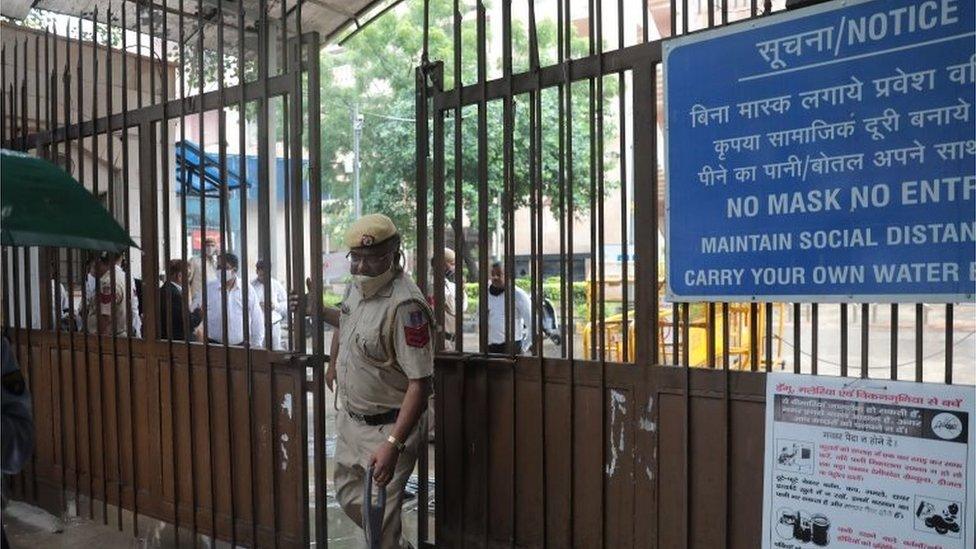 A police officer at the Rohini court after a shootout in New Delhi, India 24 September 2021.