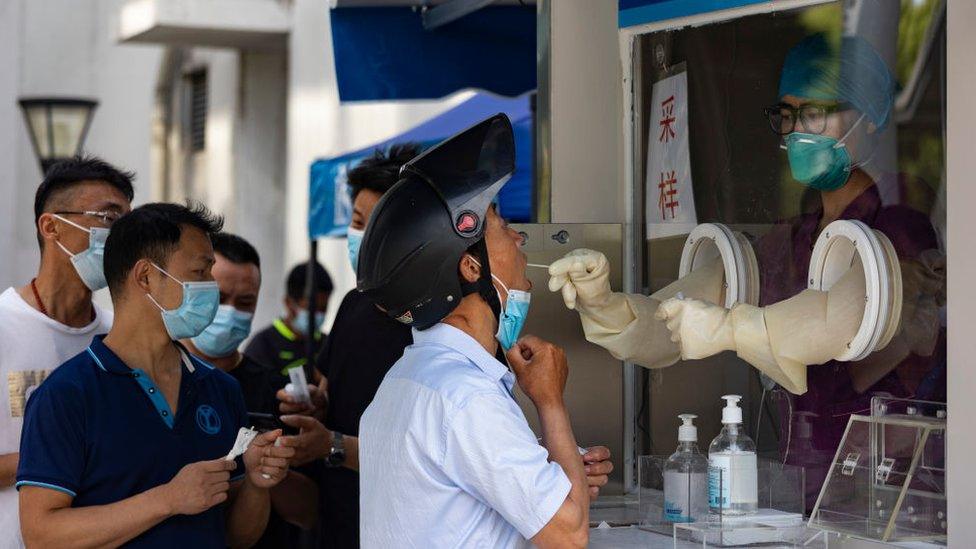 People line up for a COVID-19 test at a normalized COVID-19 test station on May 31, 2022 in Shanghai, China.