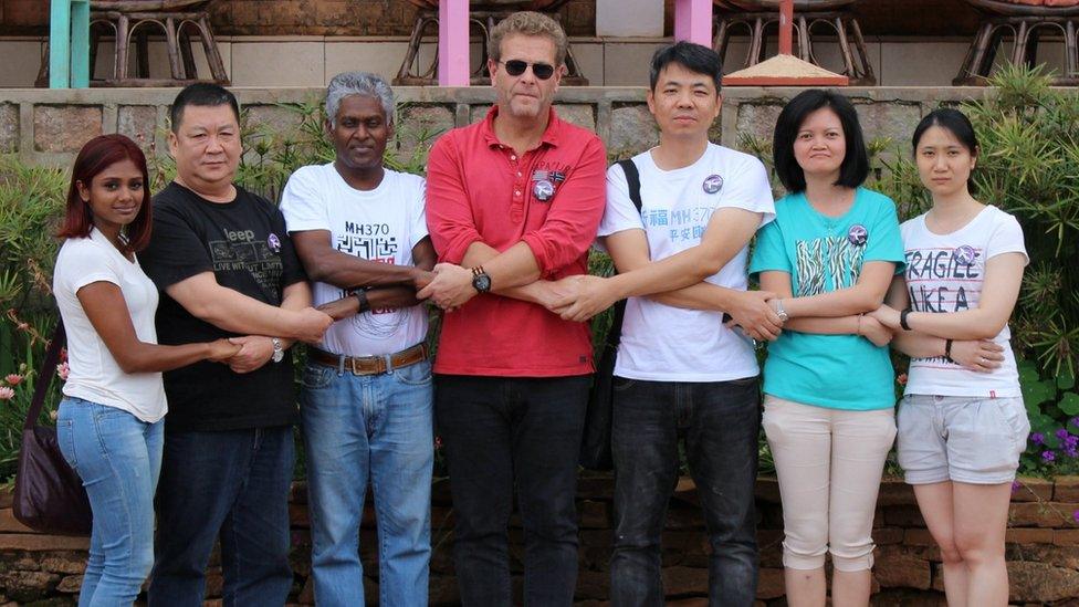 Relatives of some passengers of Malaysia Airlines Flight MH370 hold hands at the Gassy Country House Hotel in Antananarivo, Madagascar, 4 December 2016;